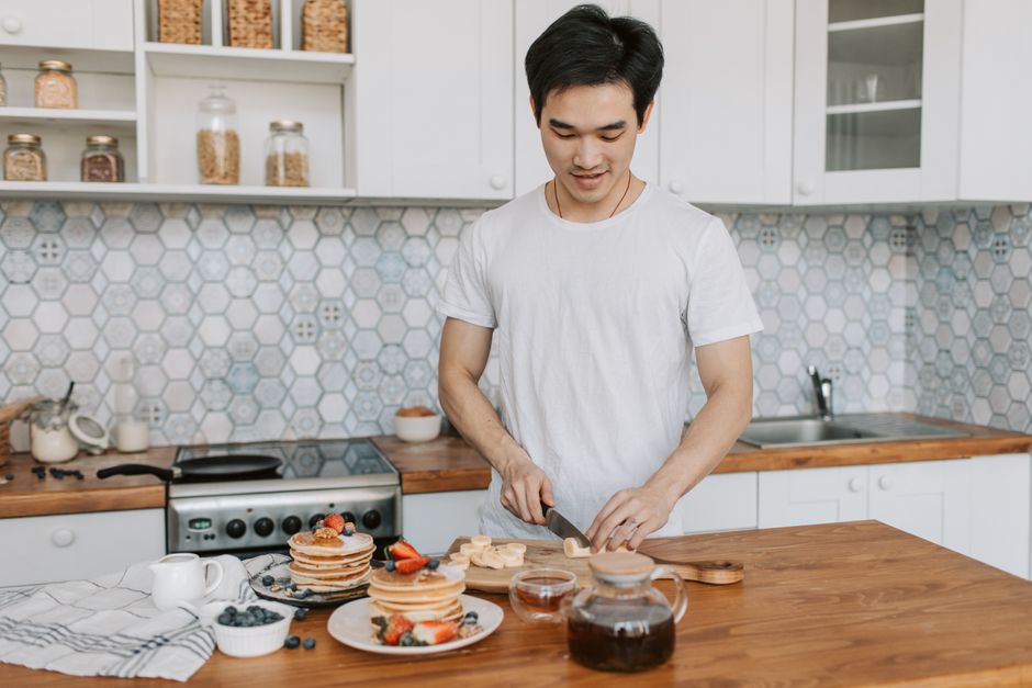 Child helping make pancakes in the kitchen