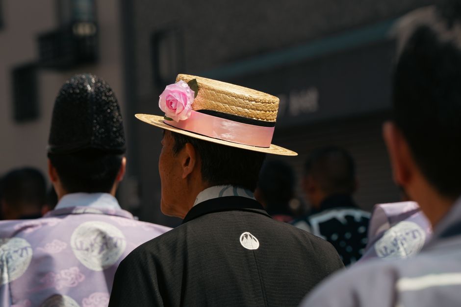Participants in traditional attire during a festive procession in Tokyo, Japan.